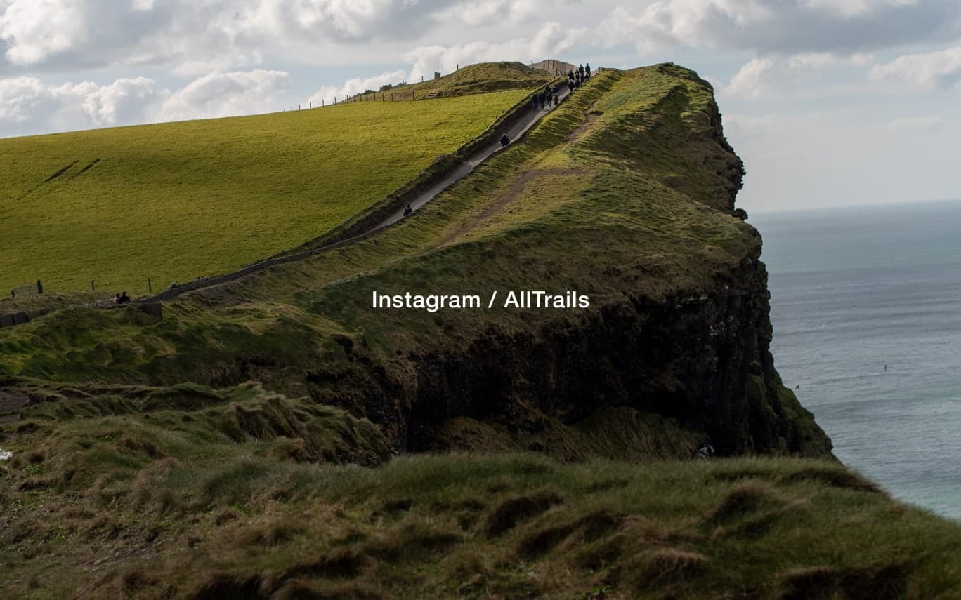 A coastal clifftop trail above the sea, captioned Instagram / AllTrails
